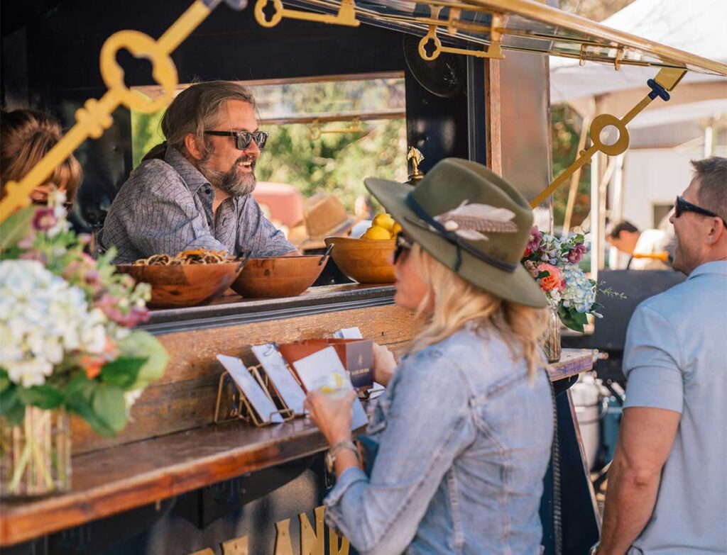 People ordering food at a festival